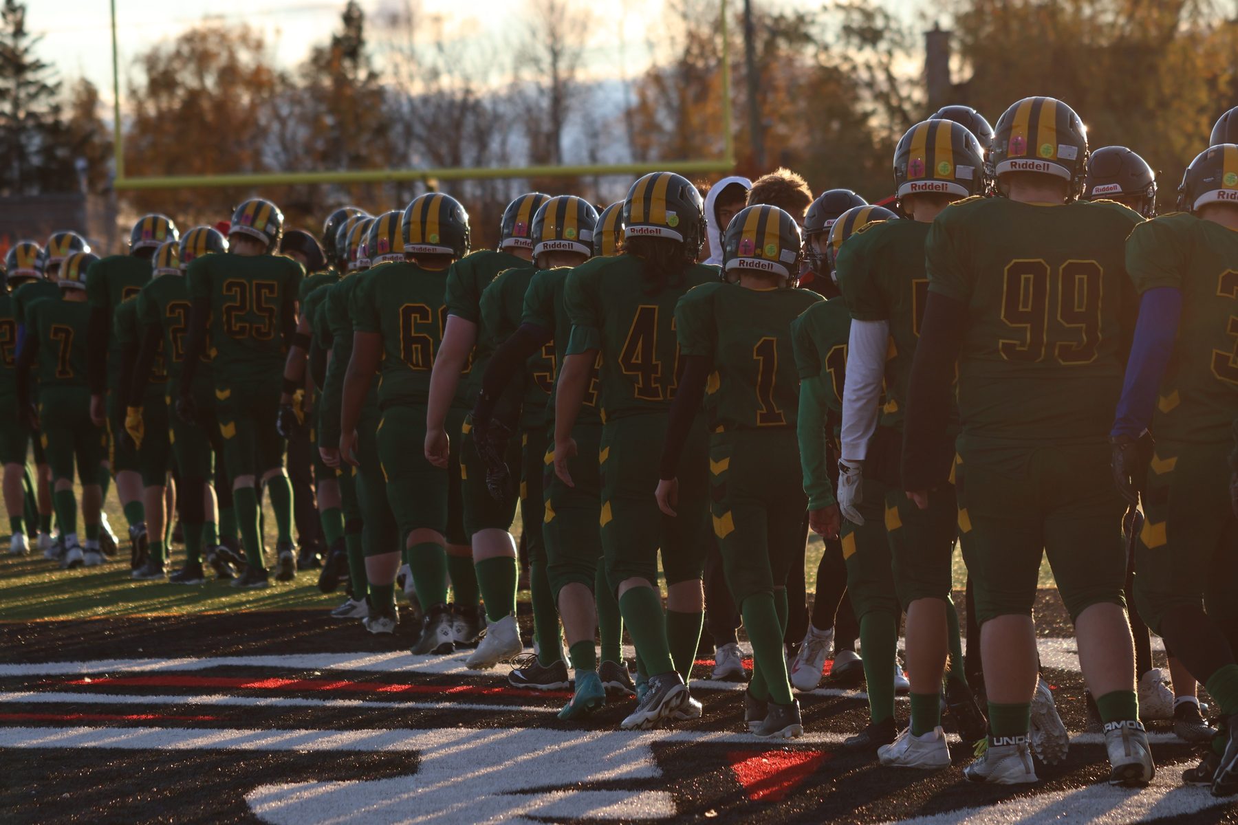 Football team lined up on the field on an autumn afternoon