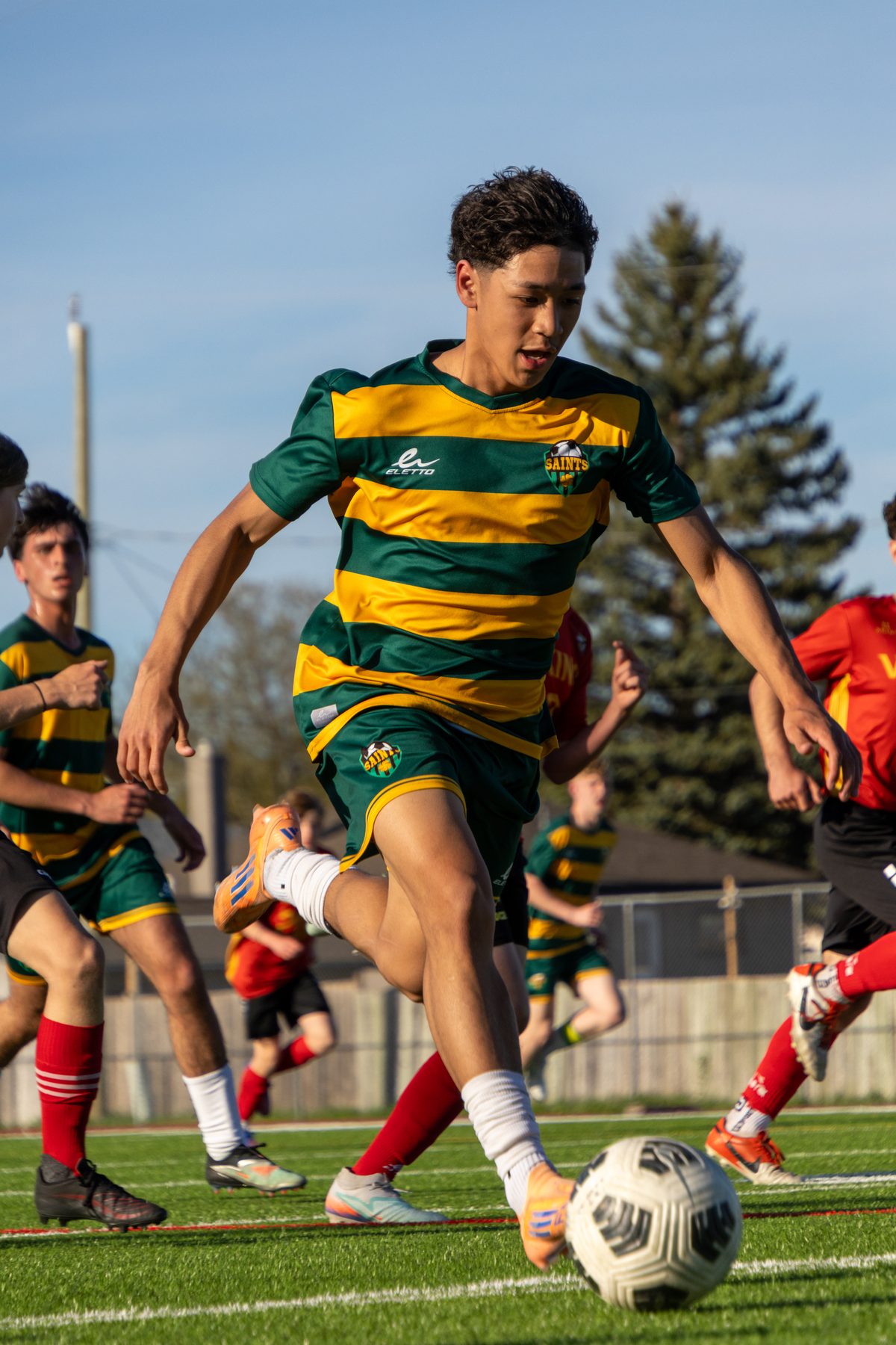 Soccer player going up to head the ball