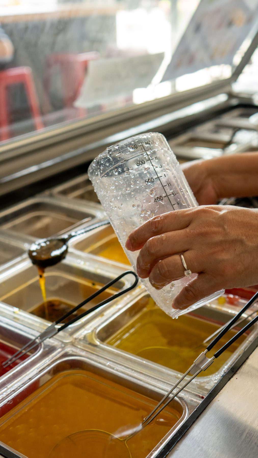 Bartender pouring a drink at the tap